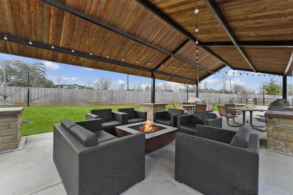 You will love using the common areas in this community! Like this covered patio with firepit and seating.