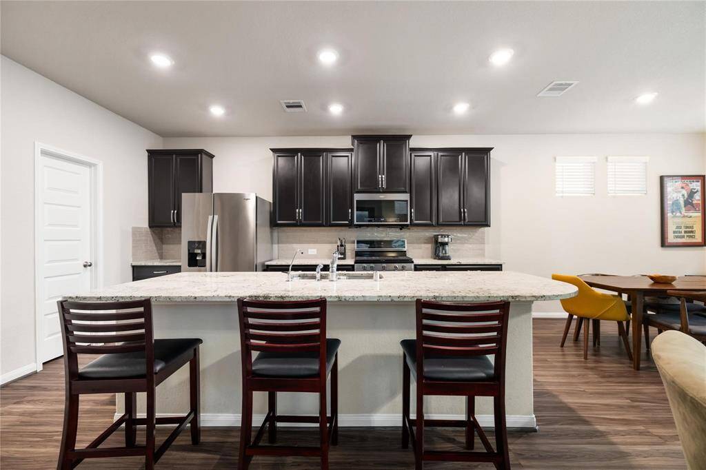 Gorgeous LVP flooring throughout this first floor. The kitchen is the heart of the home with great island space for additional seating.