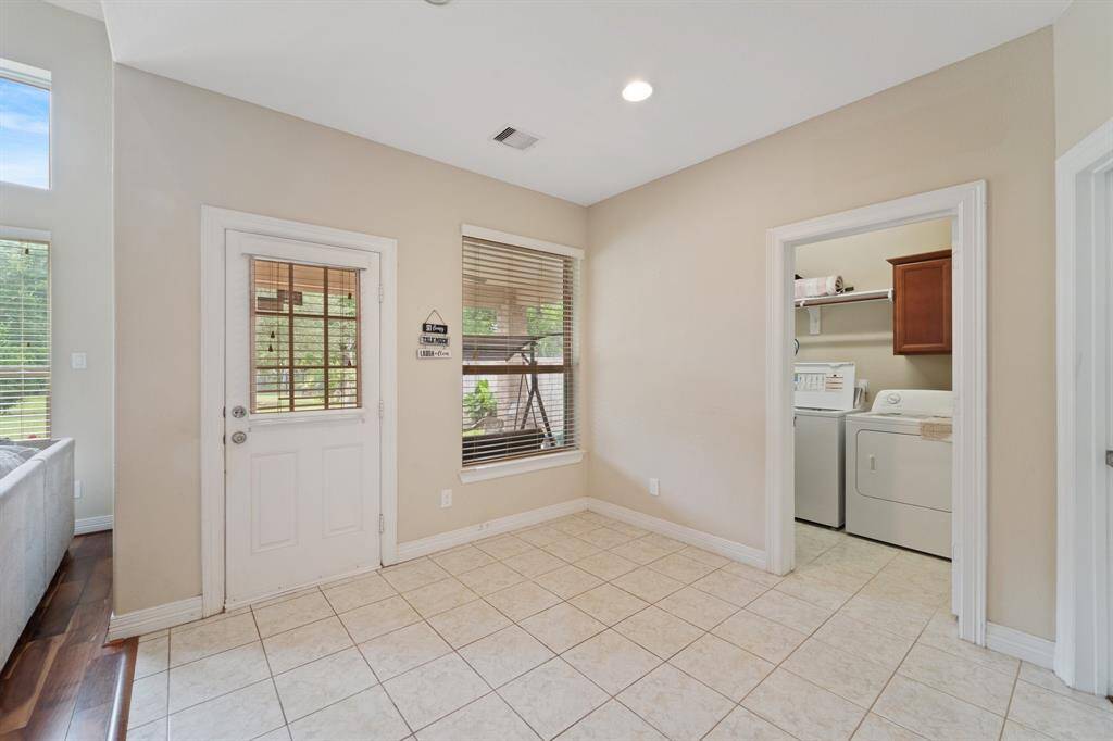 Charming breakfast nook with backyard views and direct access to the covered patio and laundry room.