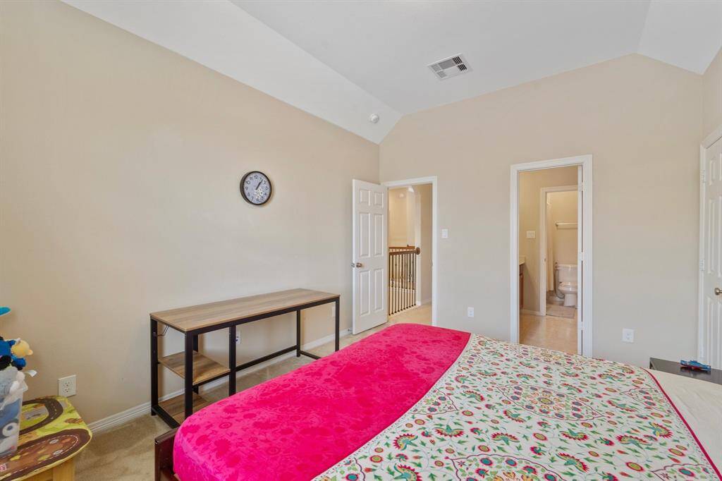 Ensuite Jack and Jill bathroom access and hallway entry make this room functional and private.