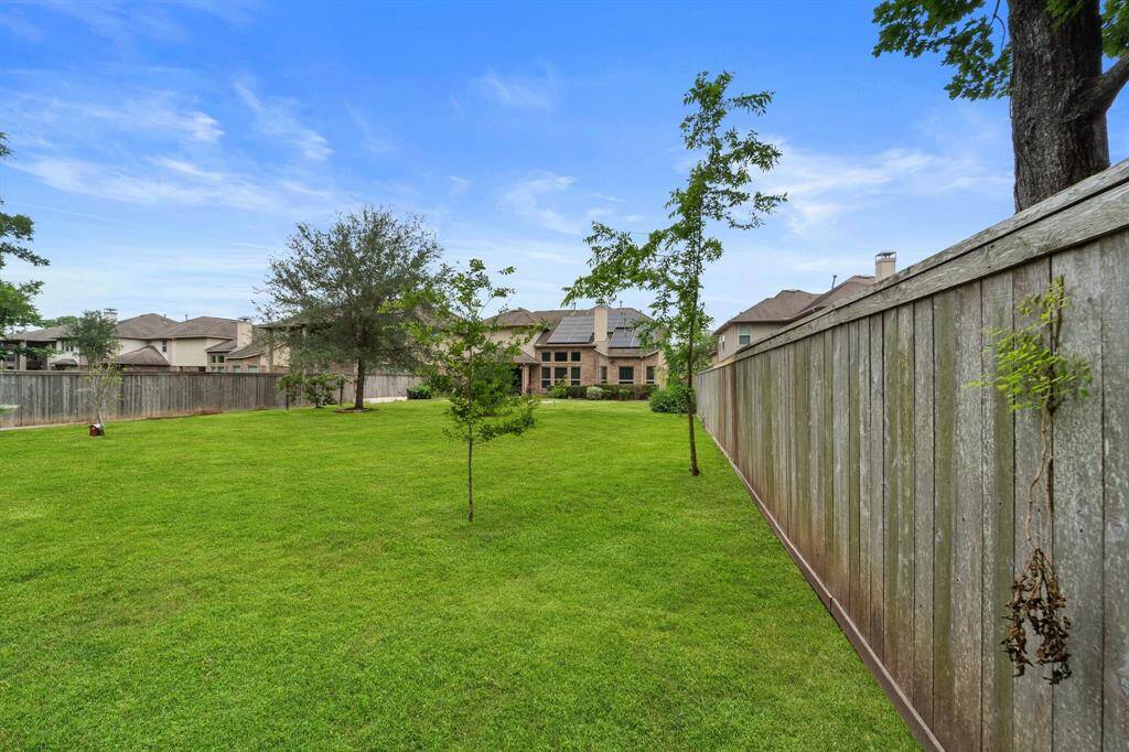 Enjoy ultimate privacy with a fully fenced yard backing to greenery—ample space for recreation or future pool.