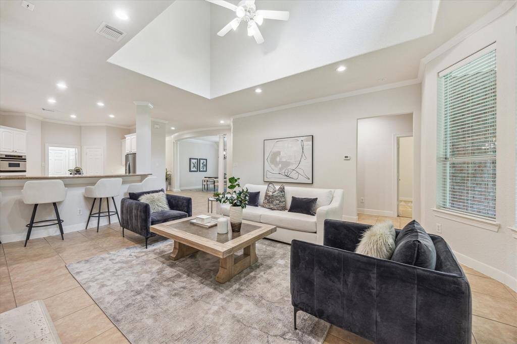 Spacious family room seamlessly connected to the kitchen, with direct access to the backyard, perfect for indoor-outdoor living and everyday comfort.