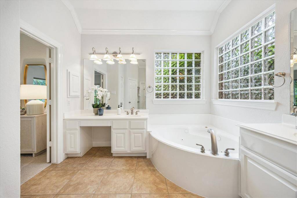 Spacious primary bathroom with generous layout.
