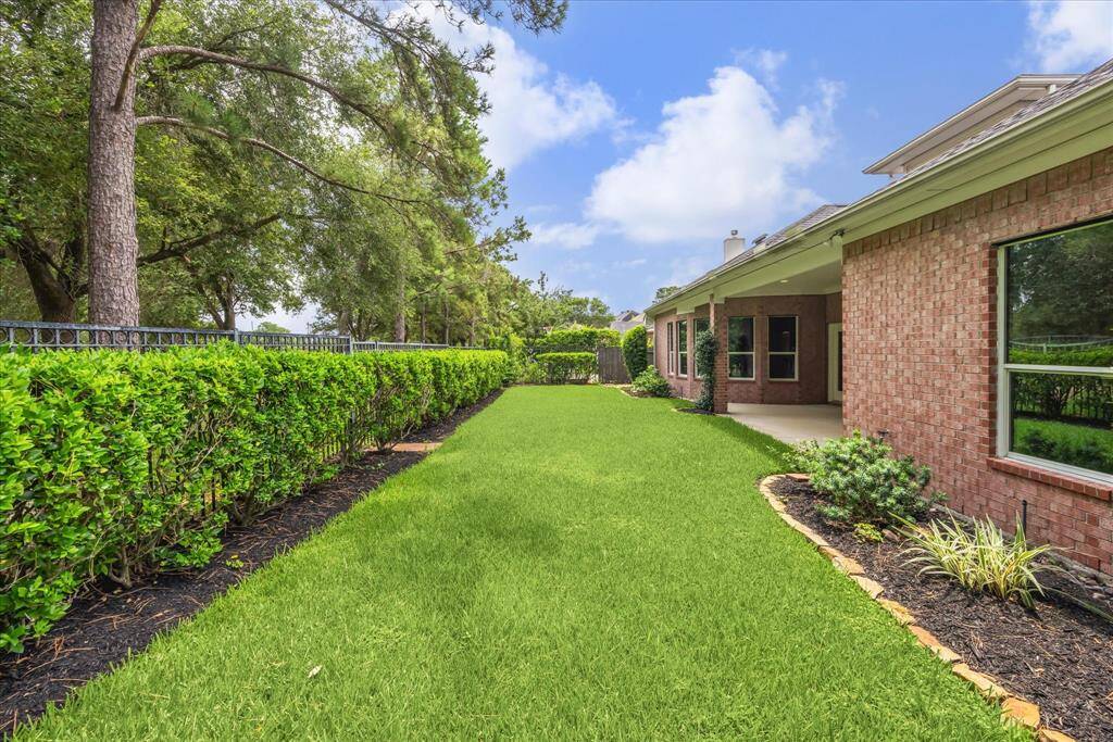 Low-maintenance backyard with open green space, perfect for enjoying the outdoors with minimal upkeep
