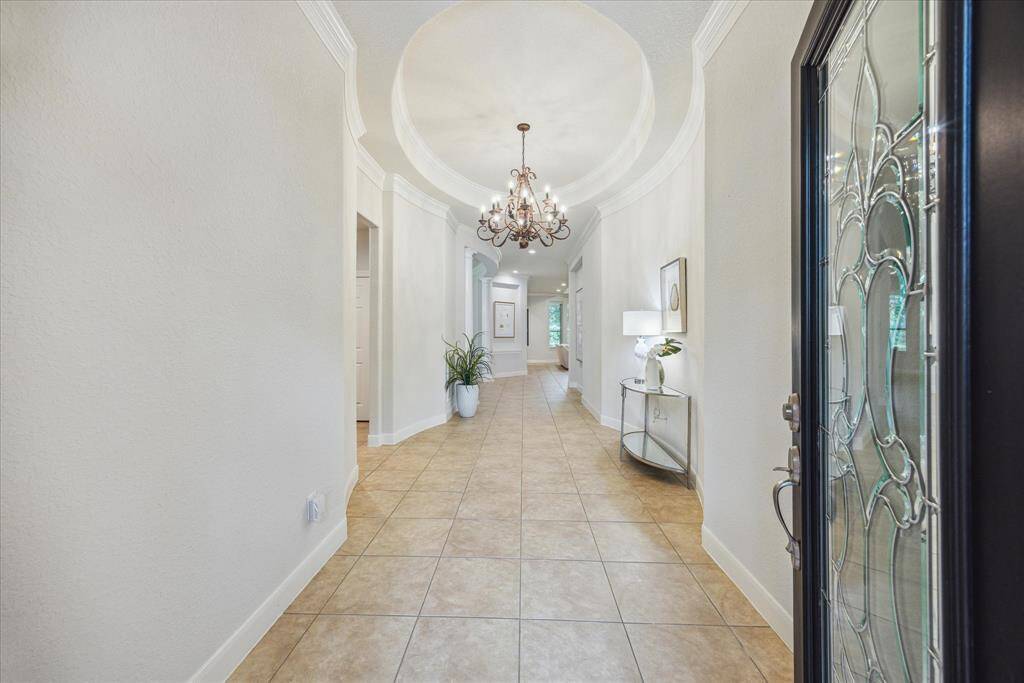 Welcoming entryway with high ceilings and a freshly painted interior, setting the tone for the home’s spacious and open layout.