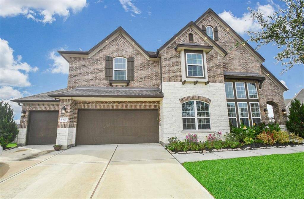 Welcome to this luxurious 3-car wide garage home with huge backyard!