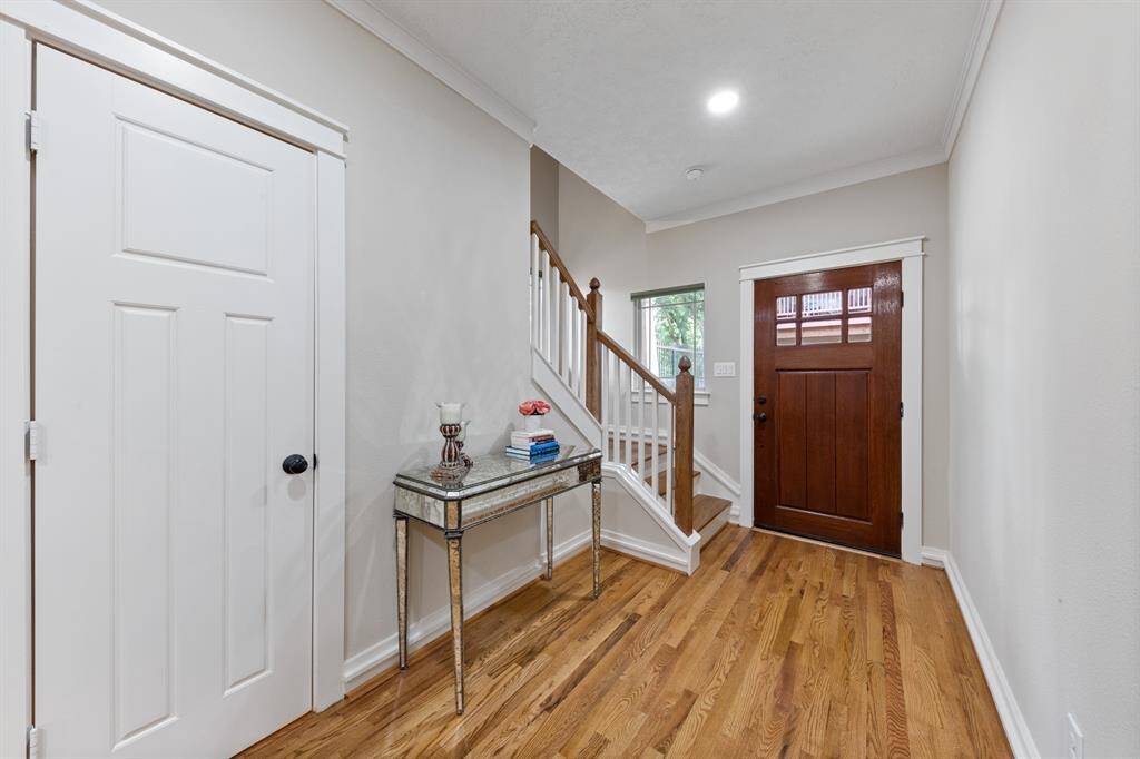 Powder room is tucked under the stairs off the entryway.P