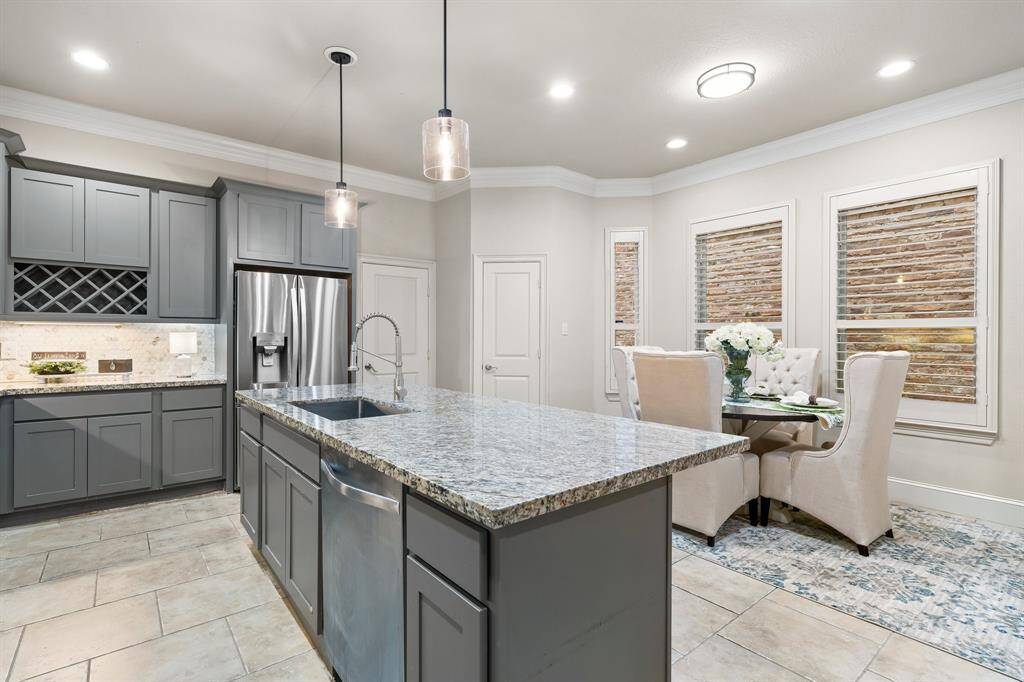 Kitchen opens to breakfast room with plenty of space for a large table and chairs.