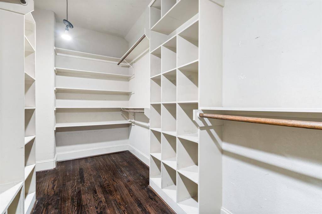 Huge primary closet with plenty of shelving.