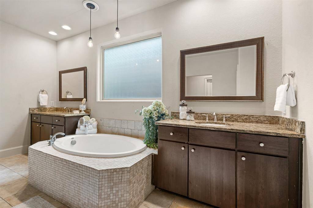 Primary bath has double sinks, soaker tub and large shower.
