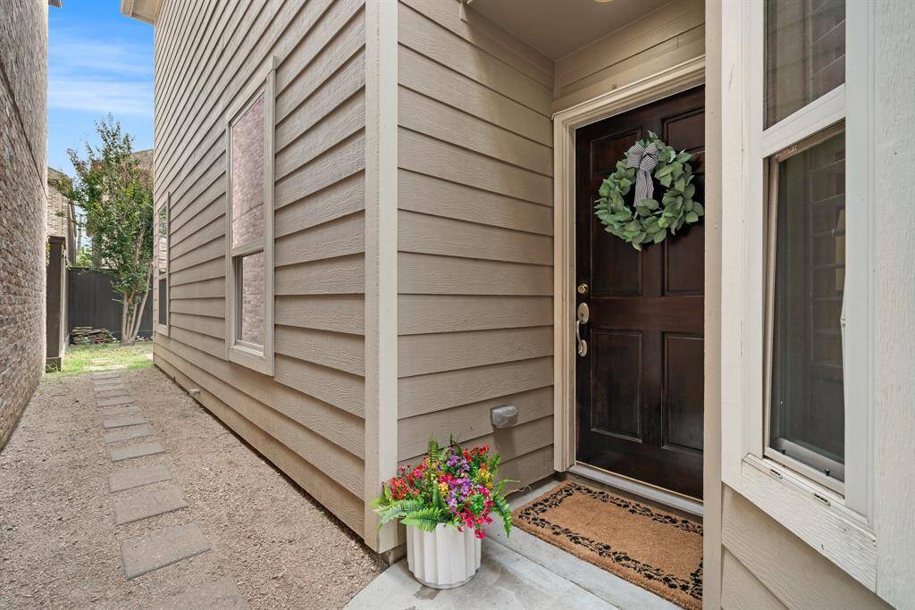 Gated entrance to yard and front door.