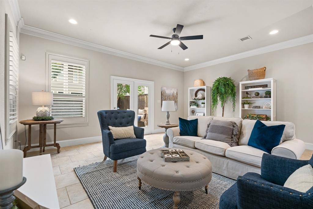 Huge great room with tile floors has plenty of room for seating and French Doors to the back patio.