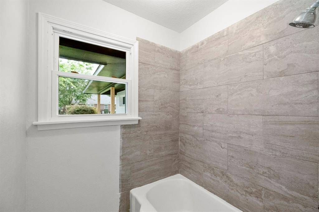New tile, but refinished original cast iron tub
