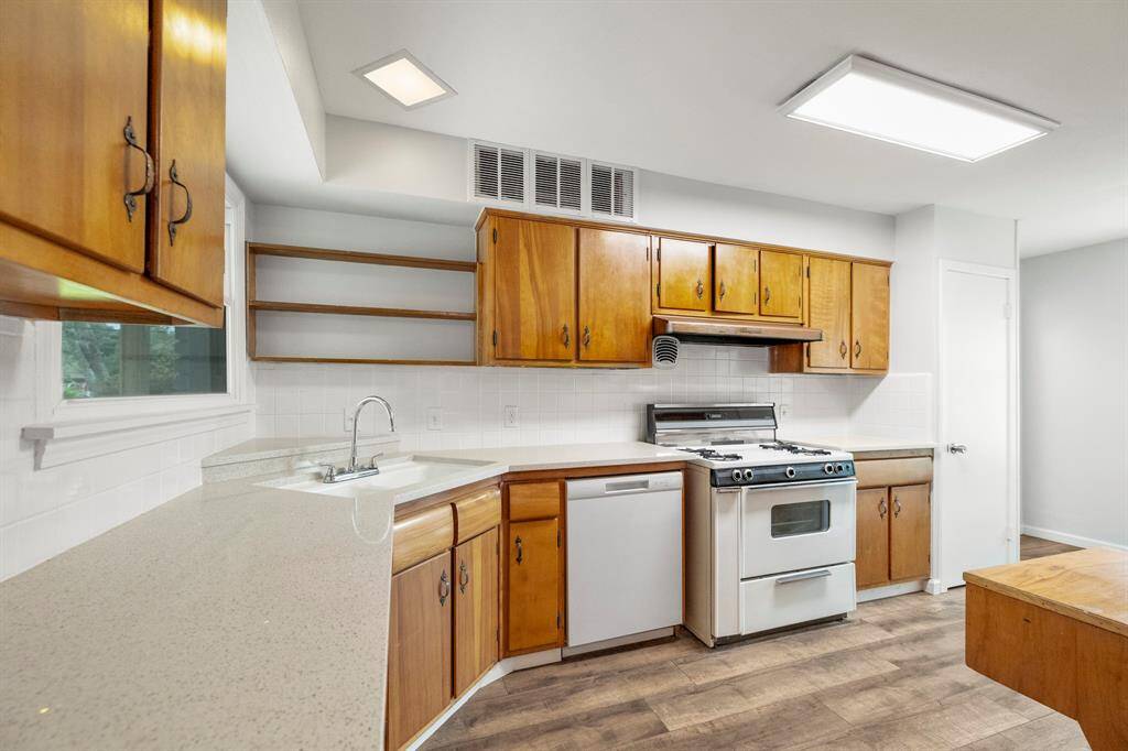 Kitchen with quartz countertops and refinished cast iron sink