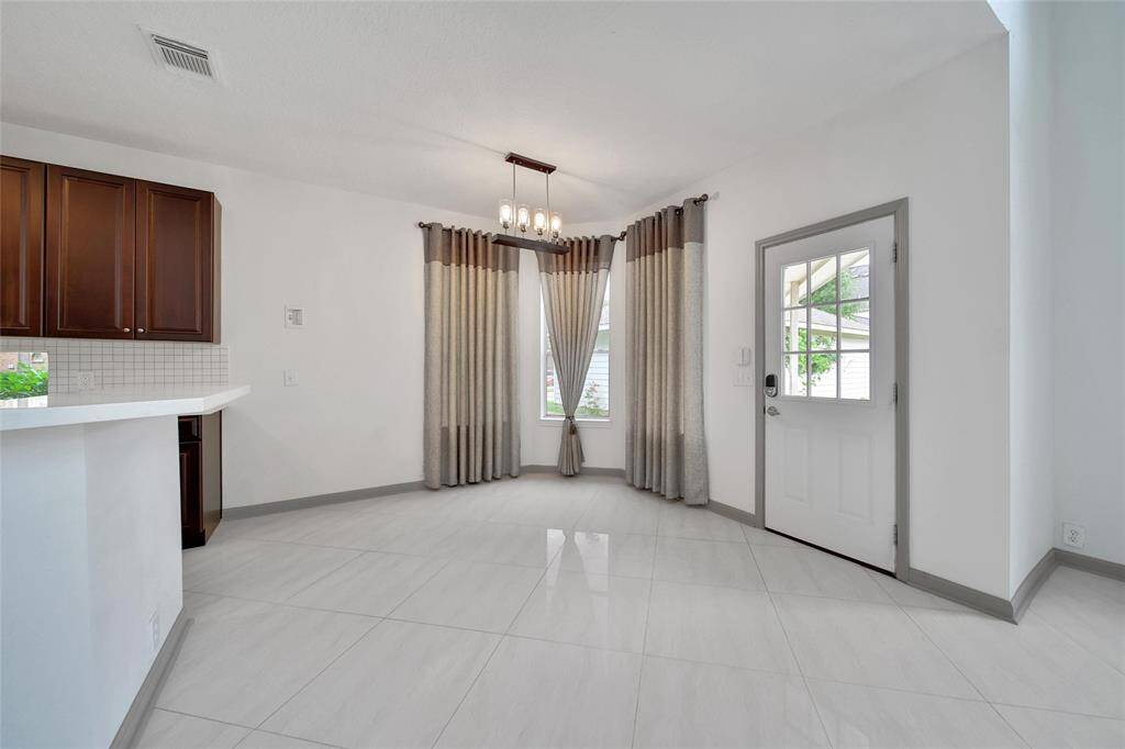 The breakfast room offers ample space for a table and chairs for everyday meals. The back door leads to the patio and detached garage, simplifying both barbeques and unloading groceries!