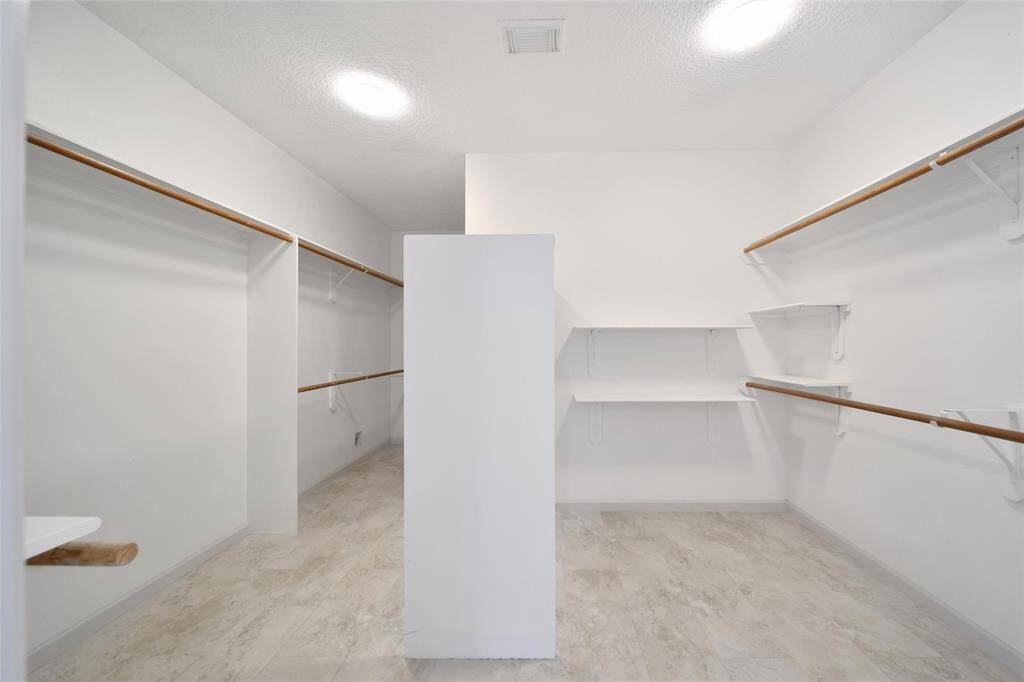 With over 40 linear feet of hanging and shelf space (not including double rods which add even more), this closet is a dream come true offering more than enough space for your clothes and accessories.