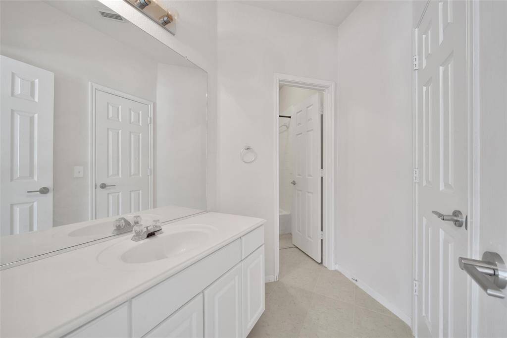 The third full bathroom has a tub/shower combination and separate vanity area.