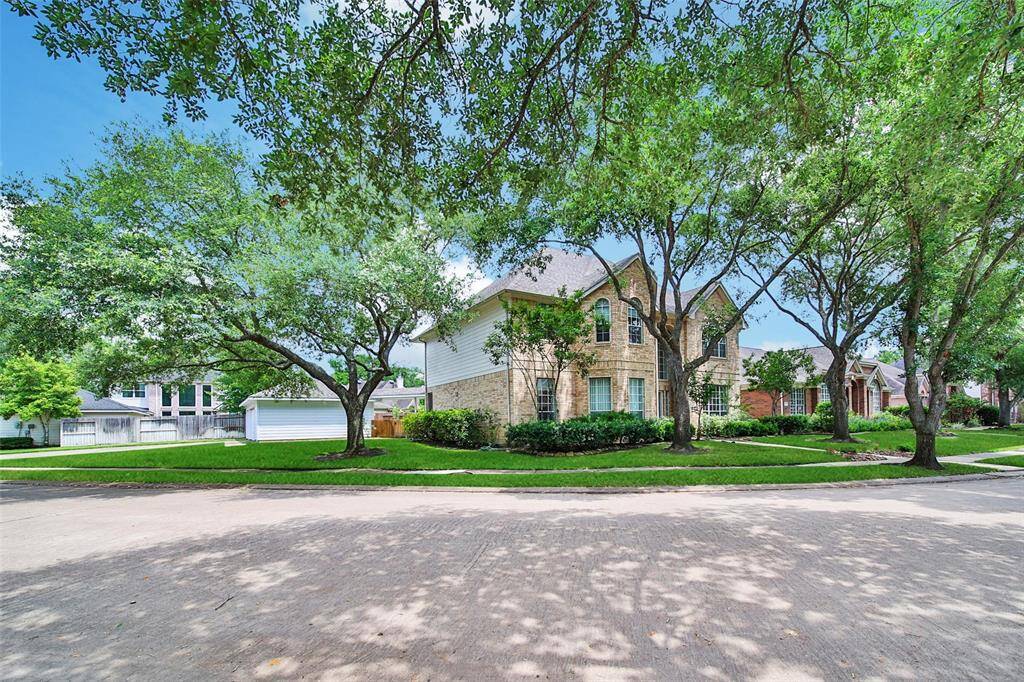 Situated on an oversized corner lot on a quiet tree-lined street in the heart of the community, this home impresses with stately curb appeal and a bountiful amount of parking space.