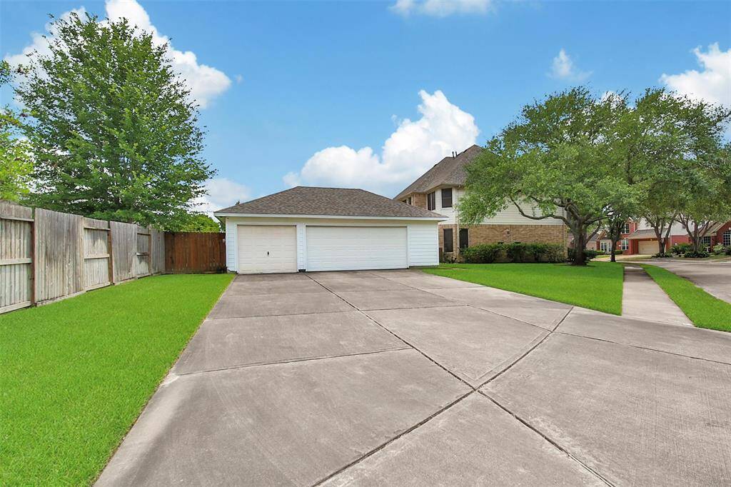 With a three car garage (third bay is currently being used as a workshop) and triple-wide extra long driveway, there's space for everyone!