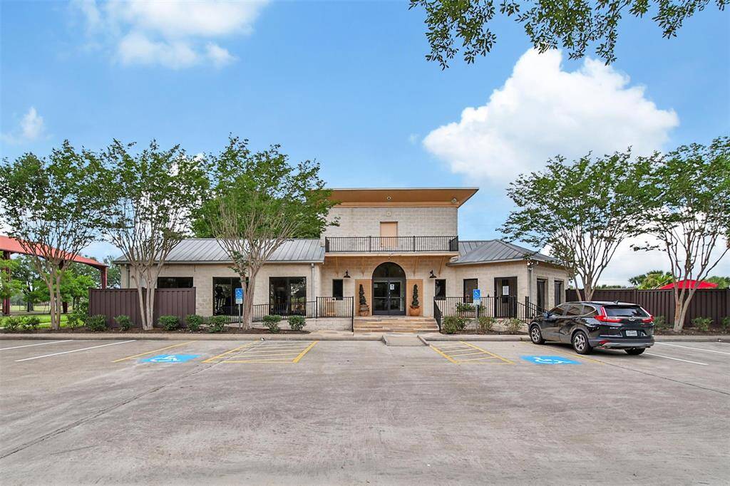 The community center features a main clubhouse with kitchenette and a fitness center for residents.