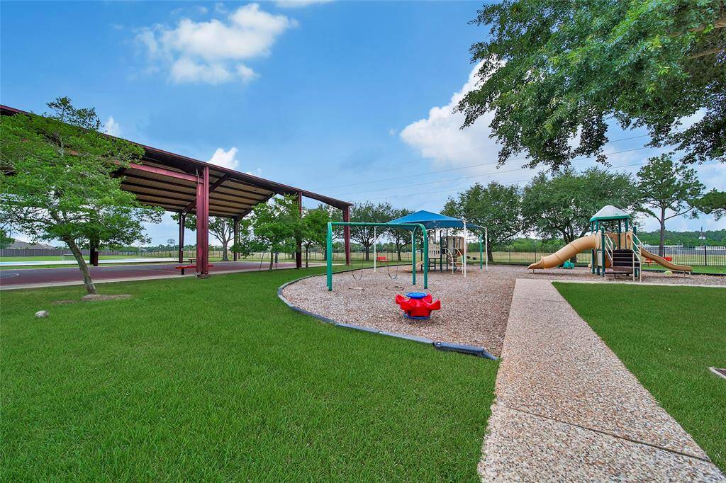 There's something for everyone at the recreation center, with a large playground, covered pavilion with basketball goals, uncovered basketball sports court, pickleball, tennis and open fields.