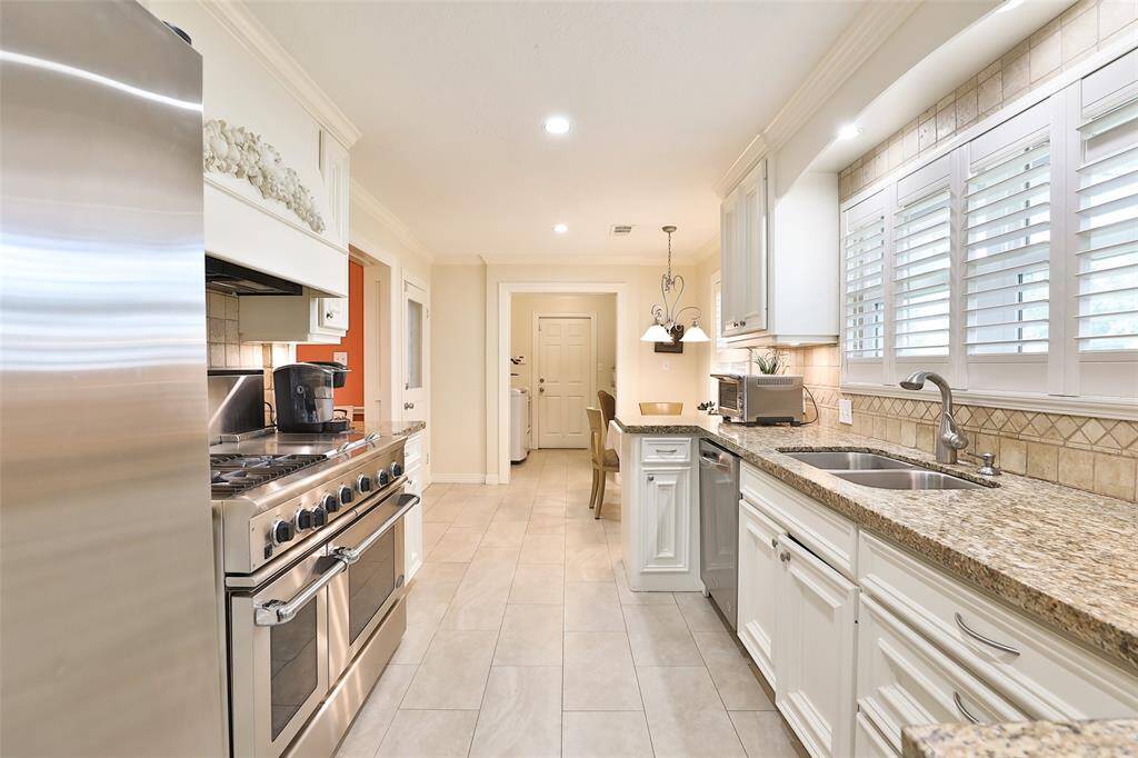 Granite countertops and lots of cabinets for great storage!  Refrigerator stays with the house!