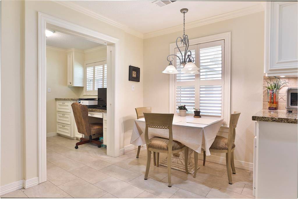 Quaint breakfast area.  Light fixture above the table is excluded from the sale of the house.