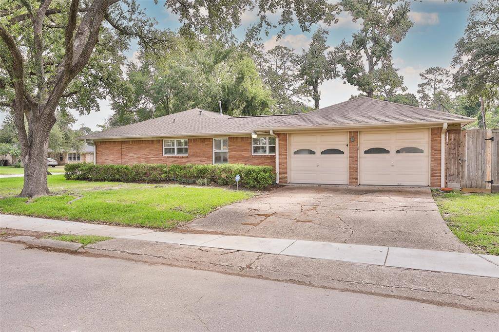 Situated on a corner lot, this home also features a 2 car attached garage, wood fencing all around and a large backyard with pool!