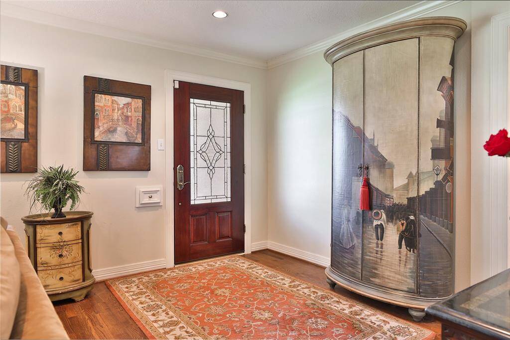 Once you enter this grand home,you are greeted with beautiful red oak hardwood floors and crown molding!