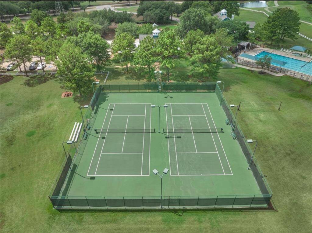 Tennis courts by the community pool