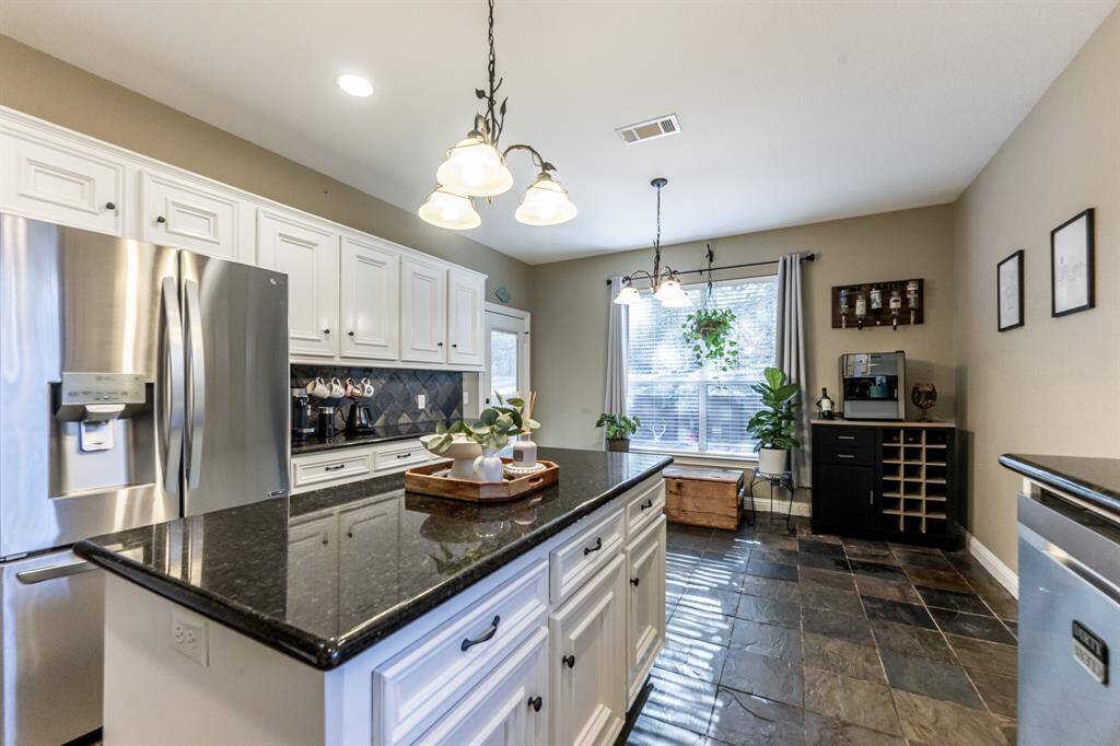 From the large center island to the sunlit breakfast nook, this kitchen blends style and space—perfect for cooking, gathering, or just admiring your morning coffee setup.