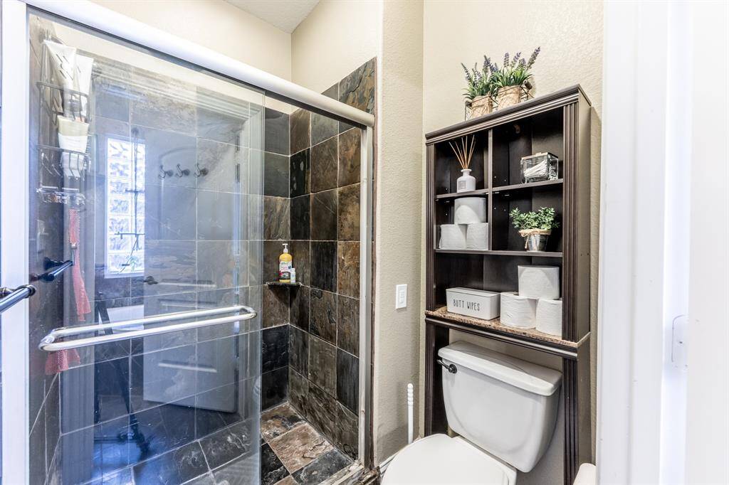 Stone-accented and spa-inspired, this walk-in shower is built for unwinding—bonus points for style and elbow room.