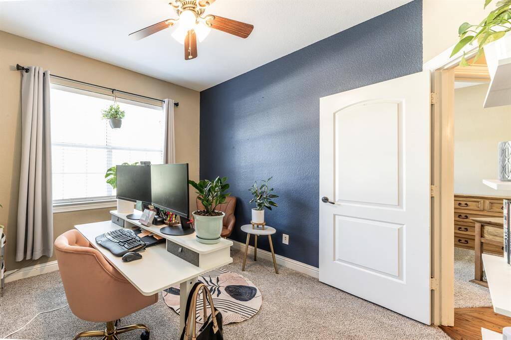 That deep navy accent wall brings the drama—in the best way. Light-filled, versatile, and full of style, this room is ready for whatever you’ve got in mind.