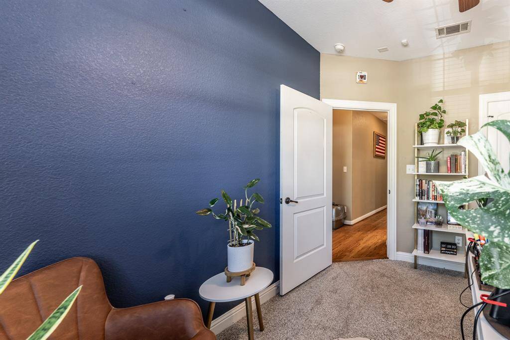 With a bold accent wall and a cozy feel, this room adds personality and charm—perfect for guests, hobbies, or winding down in style.