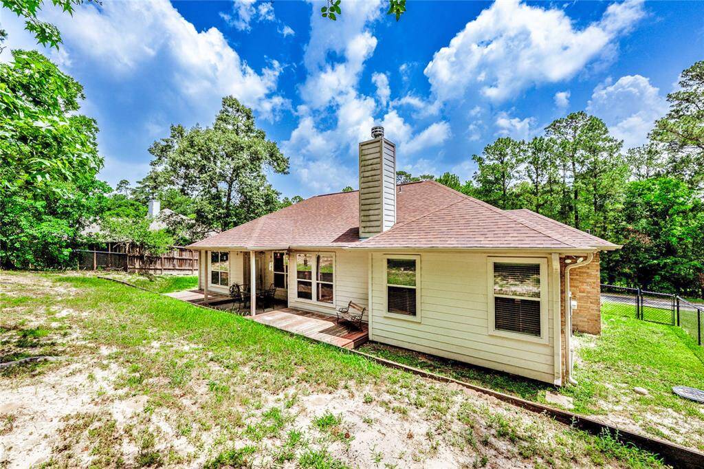 A peaceful setting with plenty of room to roam—this backyard gives you space to stretch out, soak up the sun, and enjoy a little extra privacy under the trees.