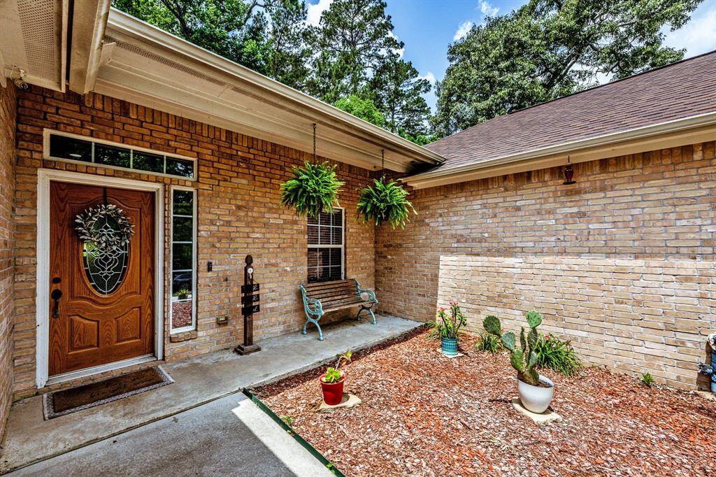 Clean lines, fresh landscaping, and a splash of personality—this entry brings just the right mix of curb appeal and character from the moment you arrive.
