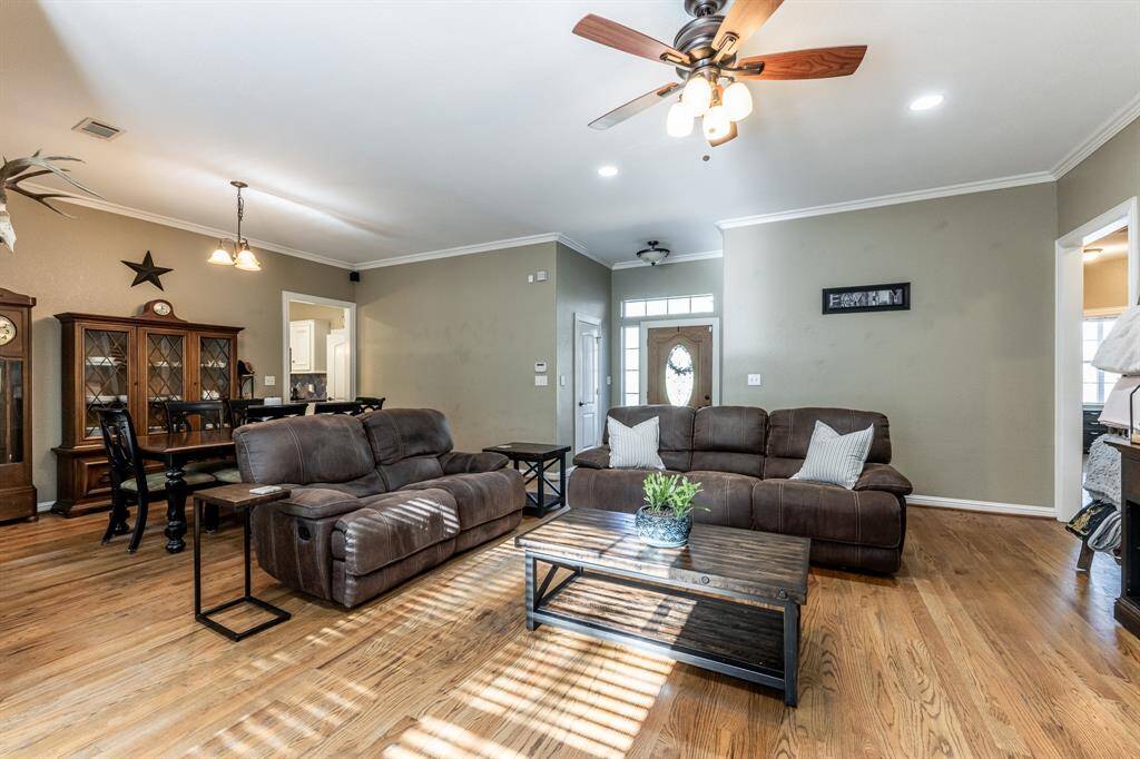 This layout really understood the assignment—wide open, full of light, and perfect for hosting game nights or just showing off those hardwood floors. From the front door to the dining room, it’s giving easy breezy living all the way through.