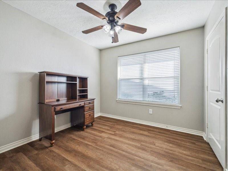 This is the second of the three extra bedrooms.  Each room throughout the home is equipped with window coverings for added privacy.