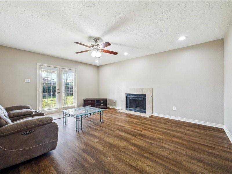 This second living area features beautiful French doors that lead directly to the backyard.