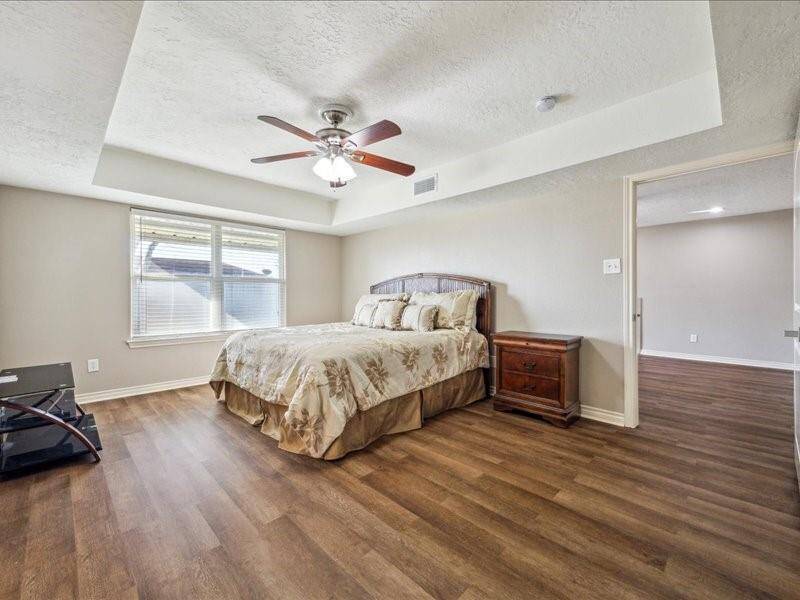The primary bedroom is a private retreat, thoughtfully positioned away from the secondary bedrooms.