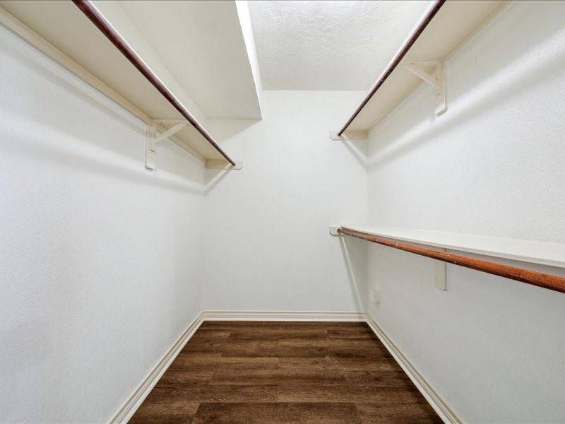 A generous walk-in closet in the primary suite provides abundant storage space.