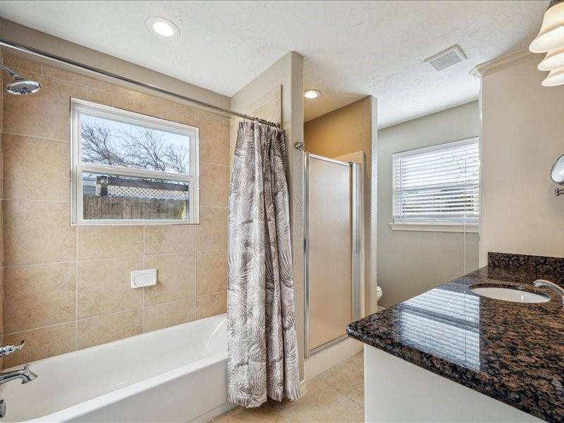 The primary bedrooms ensuite bathroom has a soaking tub and a walk-in shower for added convenience.