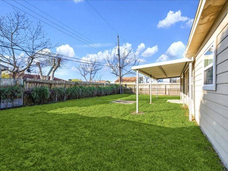 The backyard has a nice awning, perfect for some shade while you relax or hang outside.