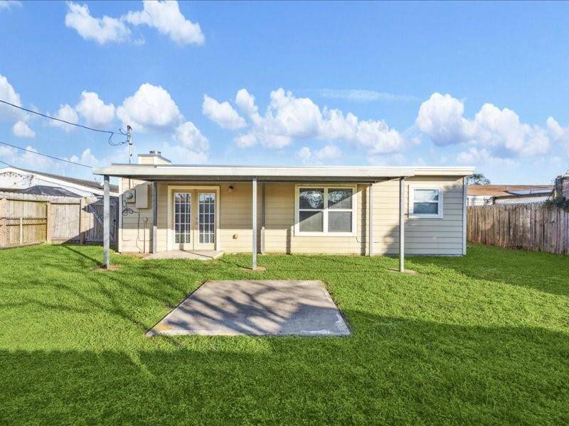 The spacious backyard provides a space for you to entertain or simply unwind in the coastal breeze.