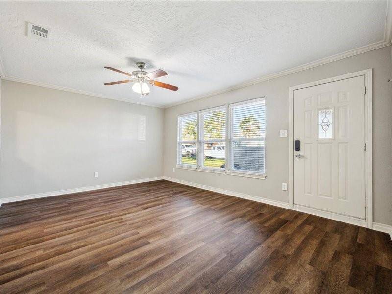 As you step inside, you are welcomed into the first living area, a bright and inviting space near the secondary bedrooms.