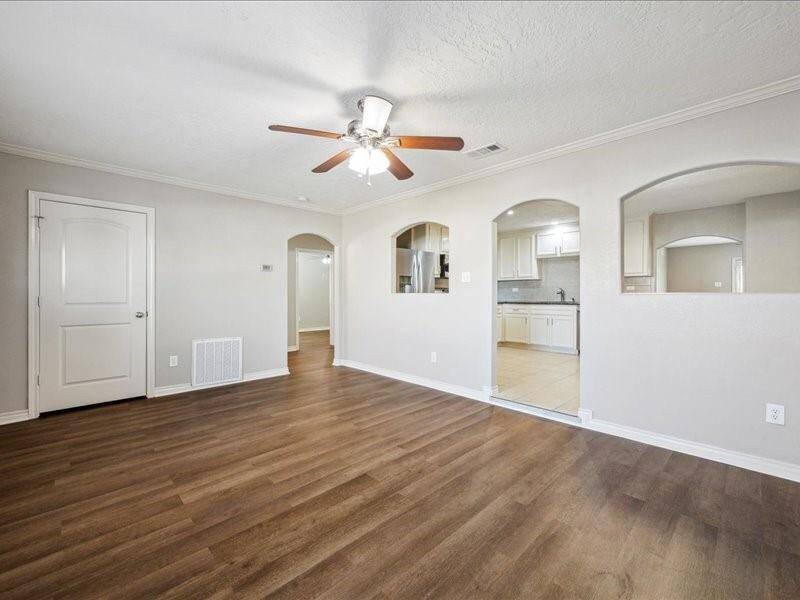 The first living space offers easy access to three comfortable bedrooms and a shared guest bath.