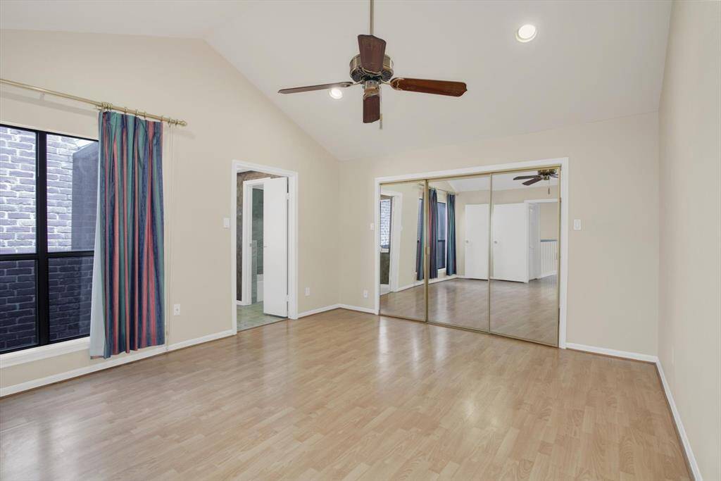 Large primary bedroom with lots of light