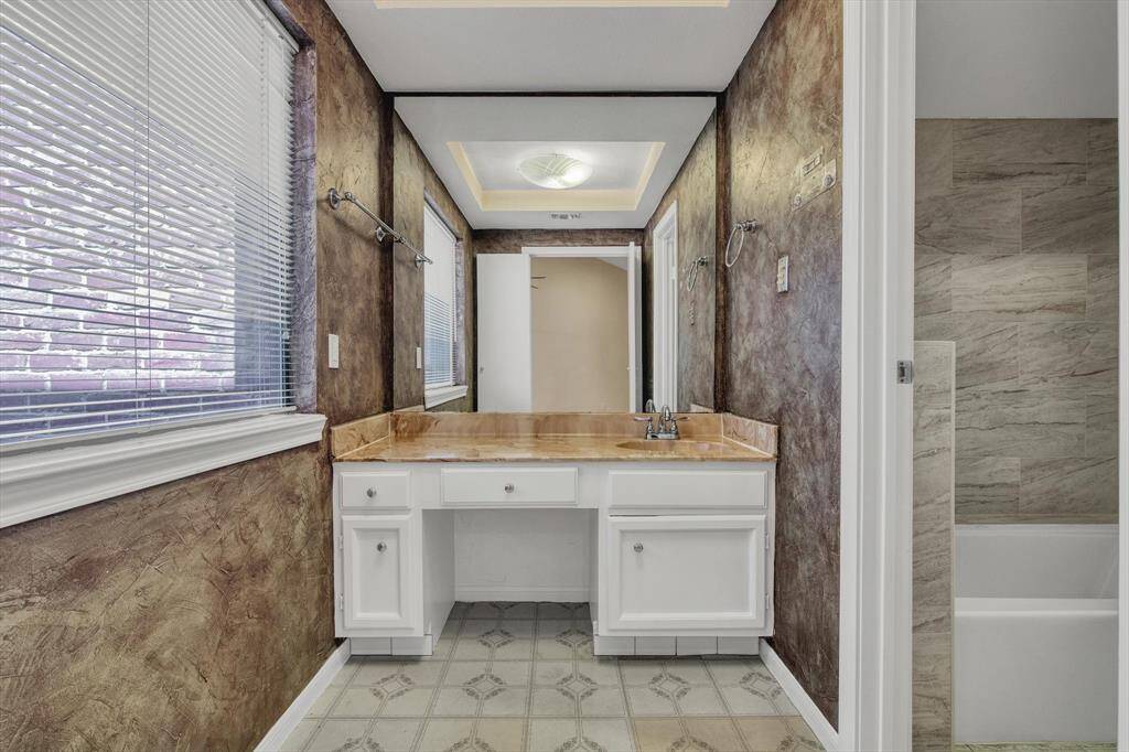 Primary bath with updated tub and toilet