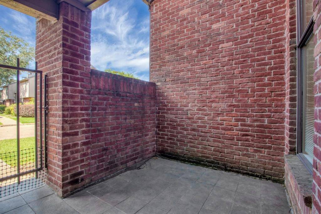 Private front patio area with gate