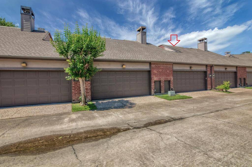 Two car garage in the rear of the home. Tiny doors are for trash can storage and pick up.